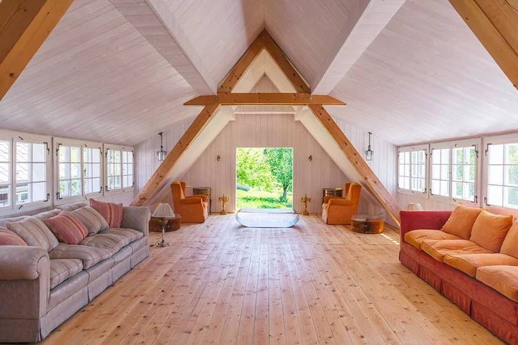 Sunlit yoga room set up for a summer retreat session